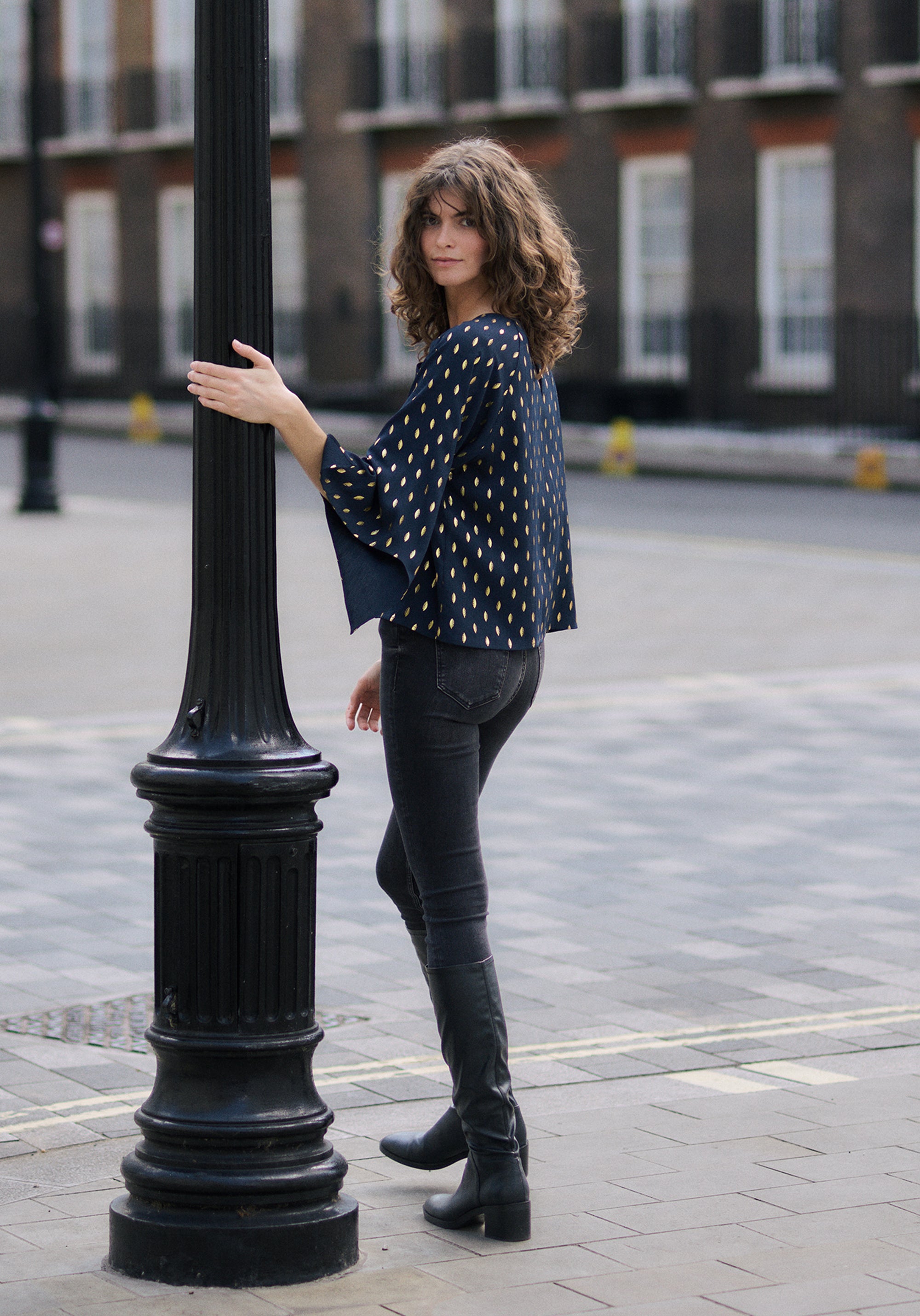 Gold Foil Print Cut-Out Draped Sleeve Top in Navy and Gold Back