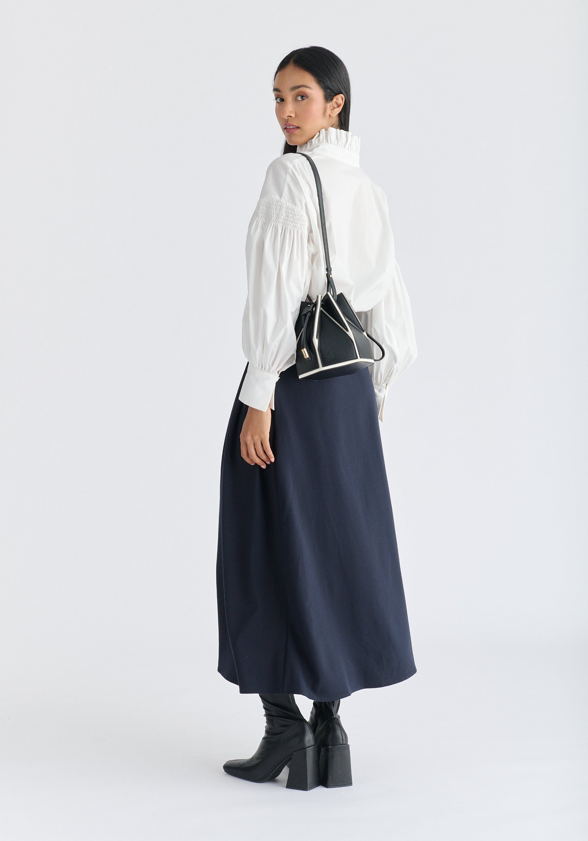 Hexagon Drawstring Bucket Bag in Black and White Front on Shoulder