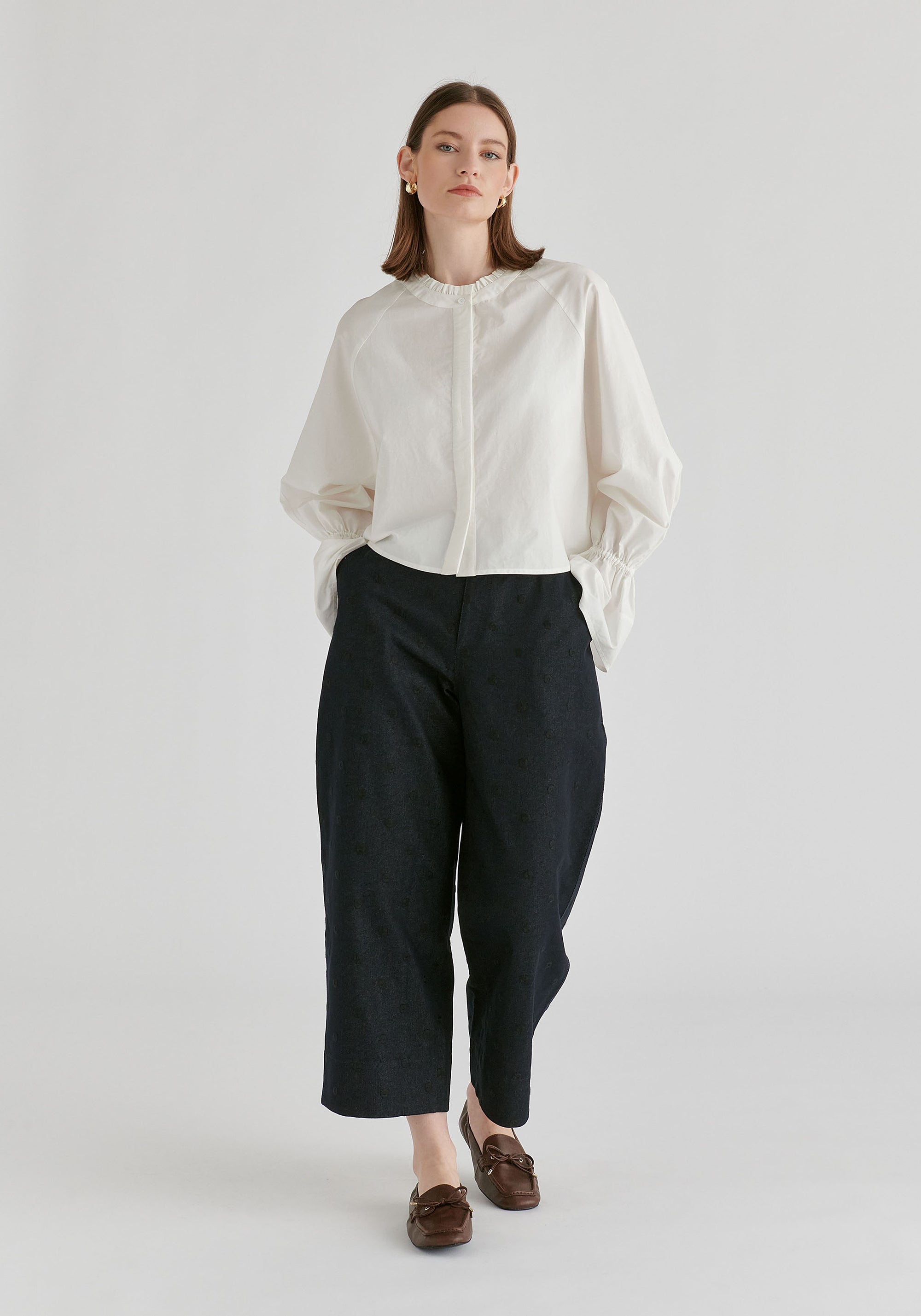 Ruffle Round Neck Blouse with Cinch Wrist Detail in White Front