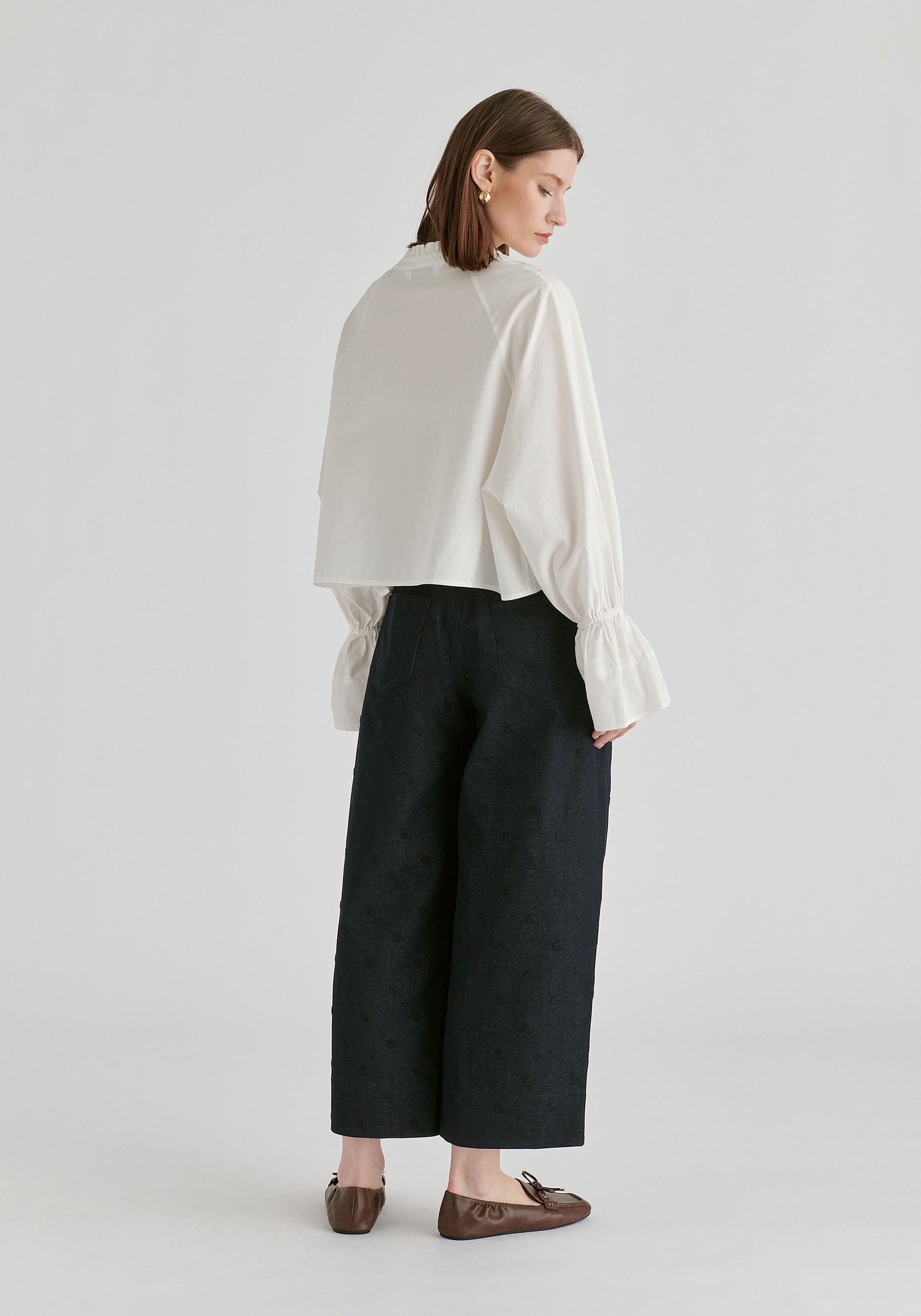 Ruffle Round Neck Blouse with Cinch Wrist Detail in White Back