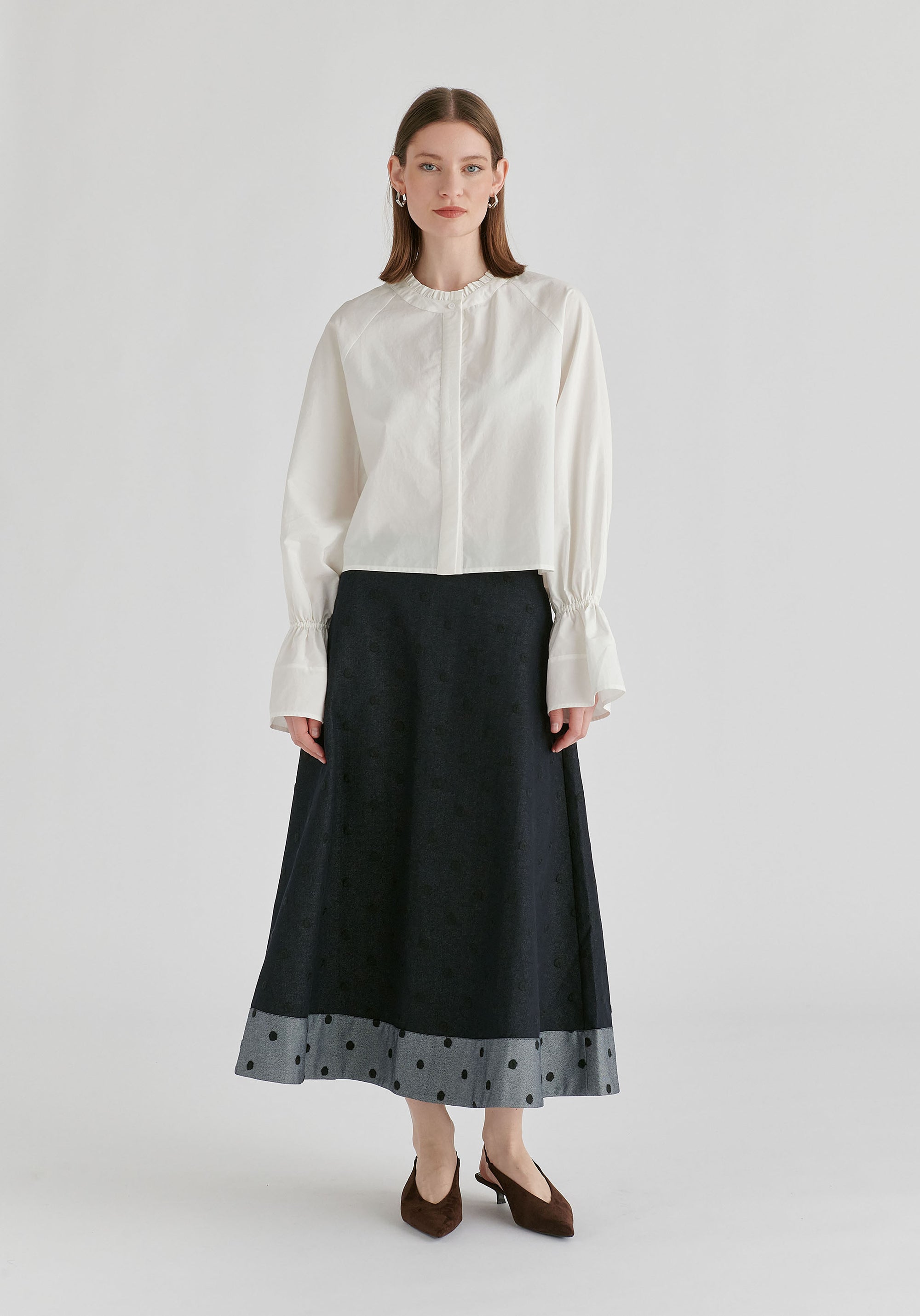 Ruffle Round Neck Blouse with Cinch Wrist Detail in White Front
