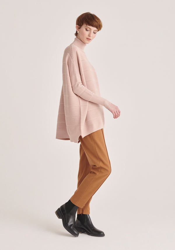 Paisie Roll Neck Ribbed Jumper with Crochet Detail in Pink Side