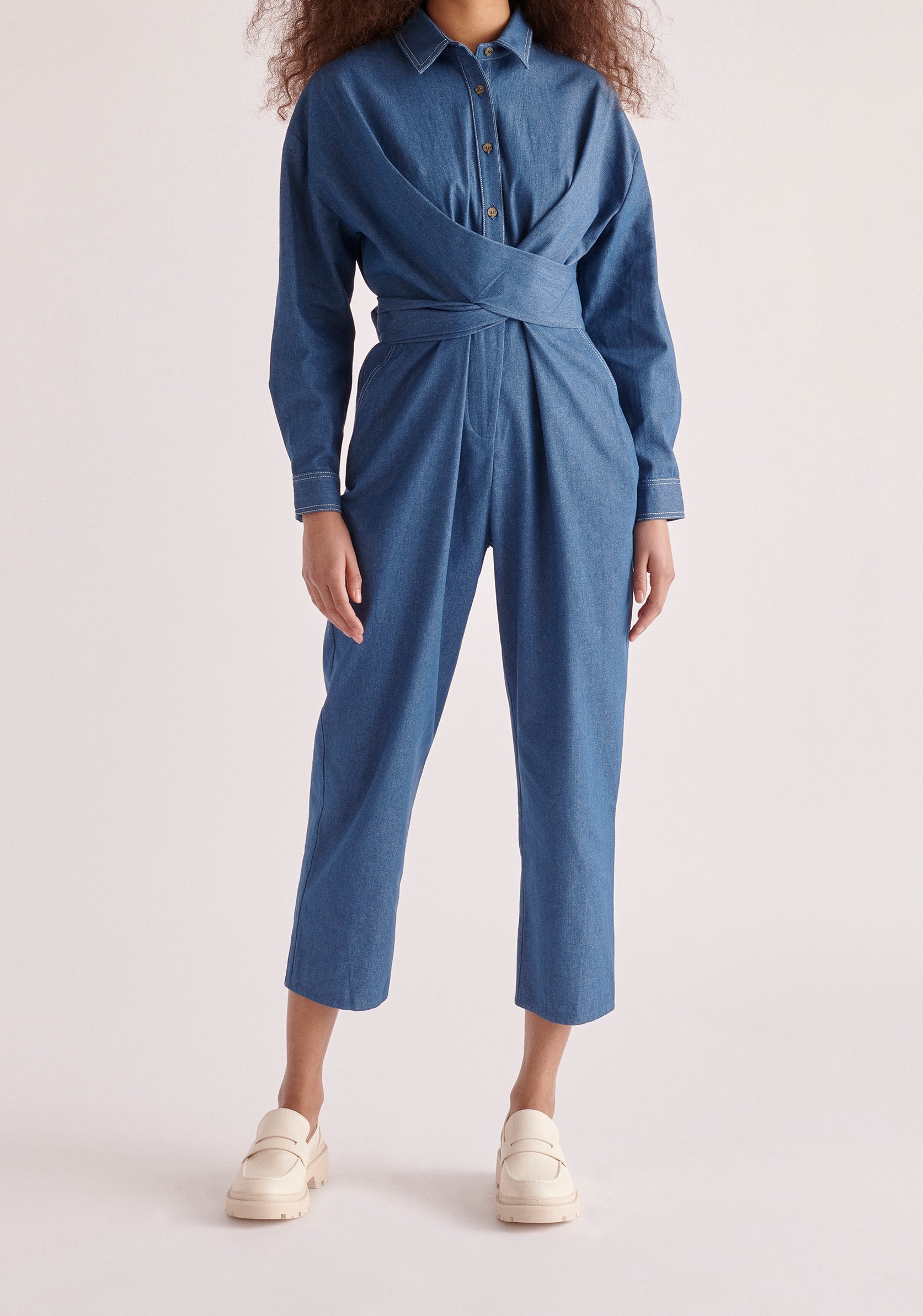 Paisie Waist Tie Denim Jumpsuit in Light Blue