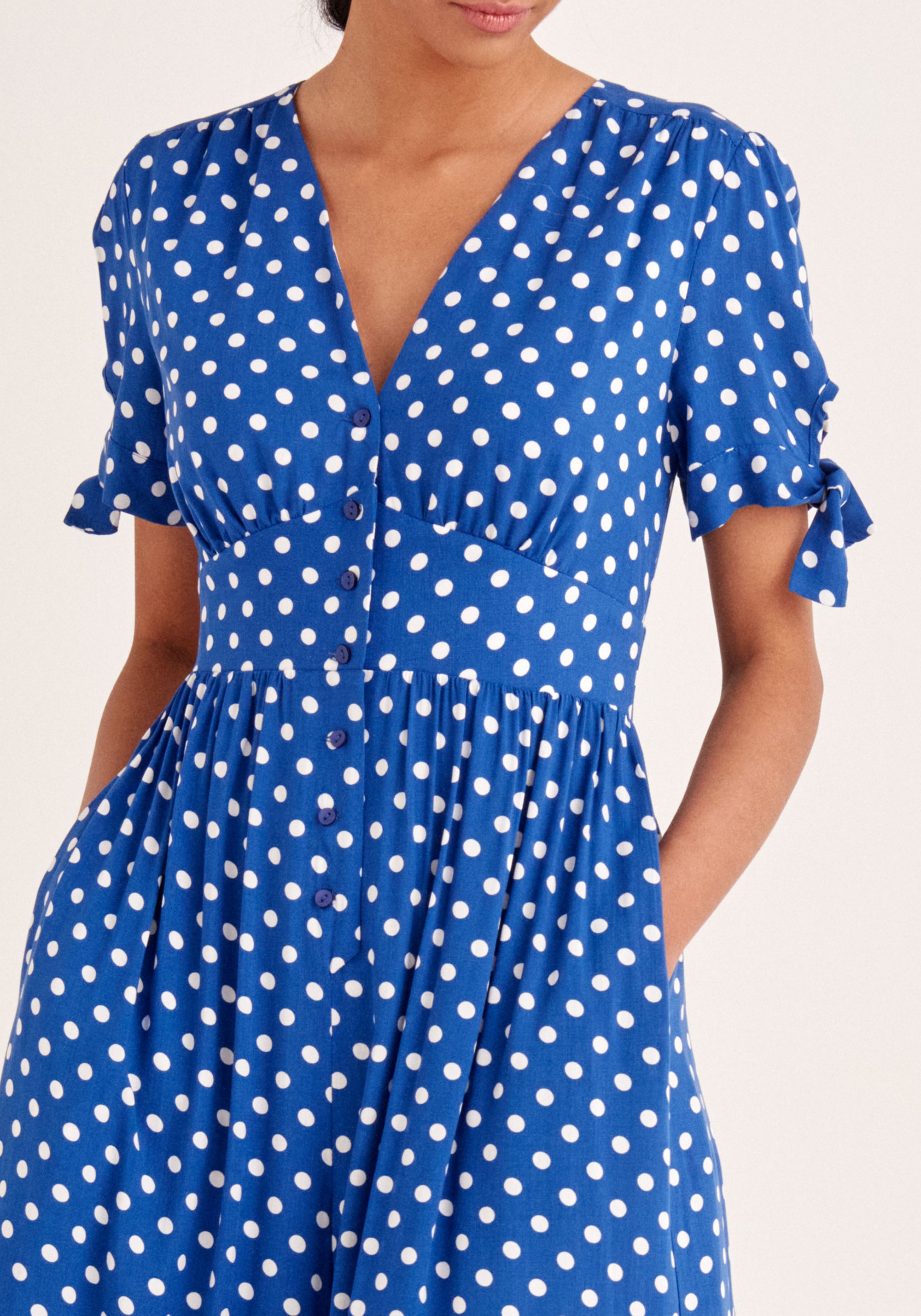 Paisie Sleeve Tie Polka Dot Jumpsuit in Dark Blue and White Close Up