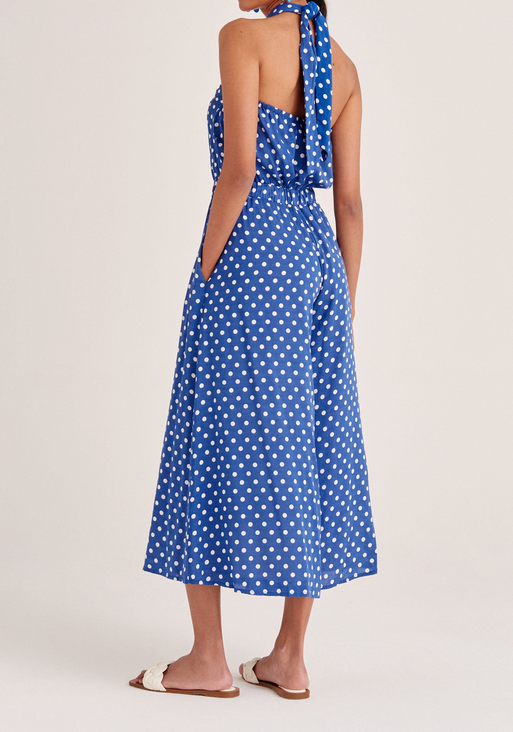 Paisie Polka Dot Halterneck Wrap Jumpsuit in Dark Blue and White Back