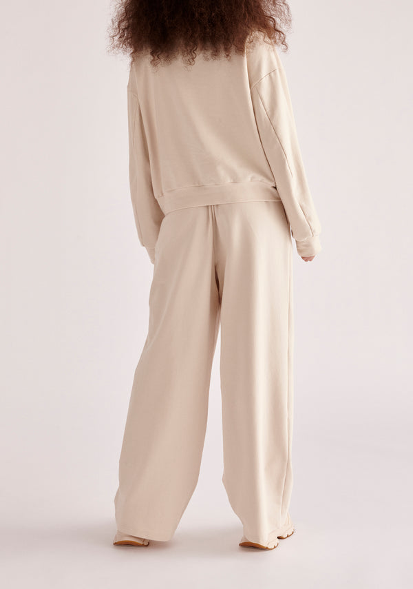 Paisie High Neck Zip Sweatshirt in Cream Back