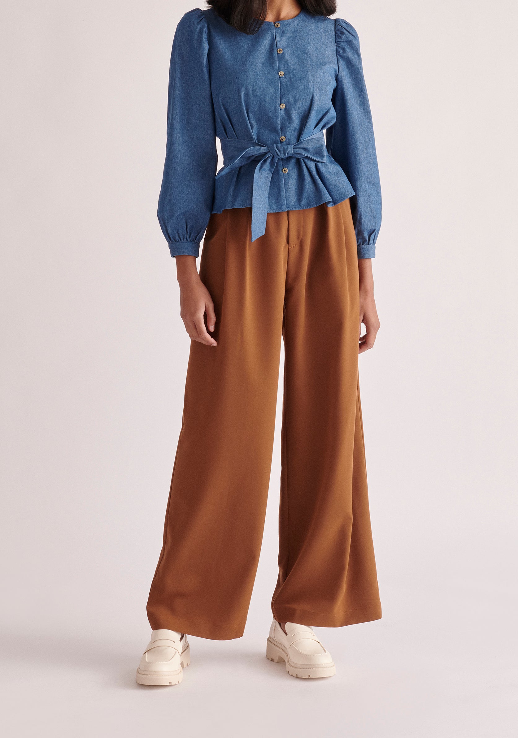Paisie Long Sleeve Belted Denim Blouse in Light Blue 