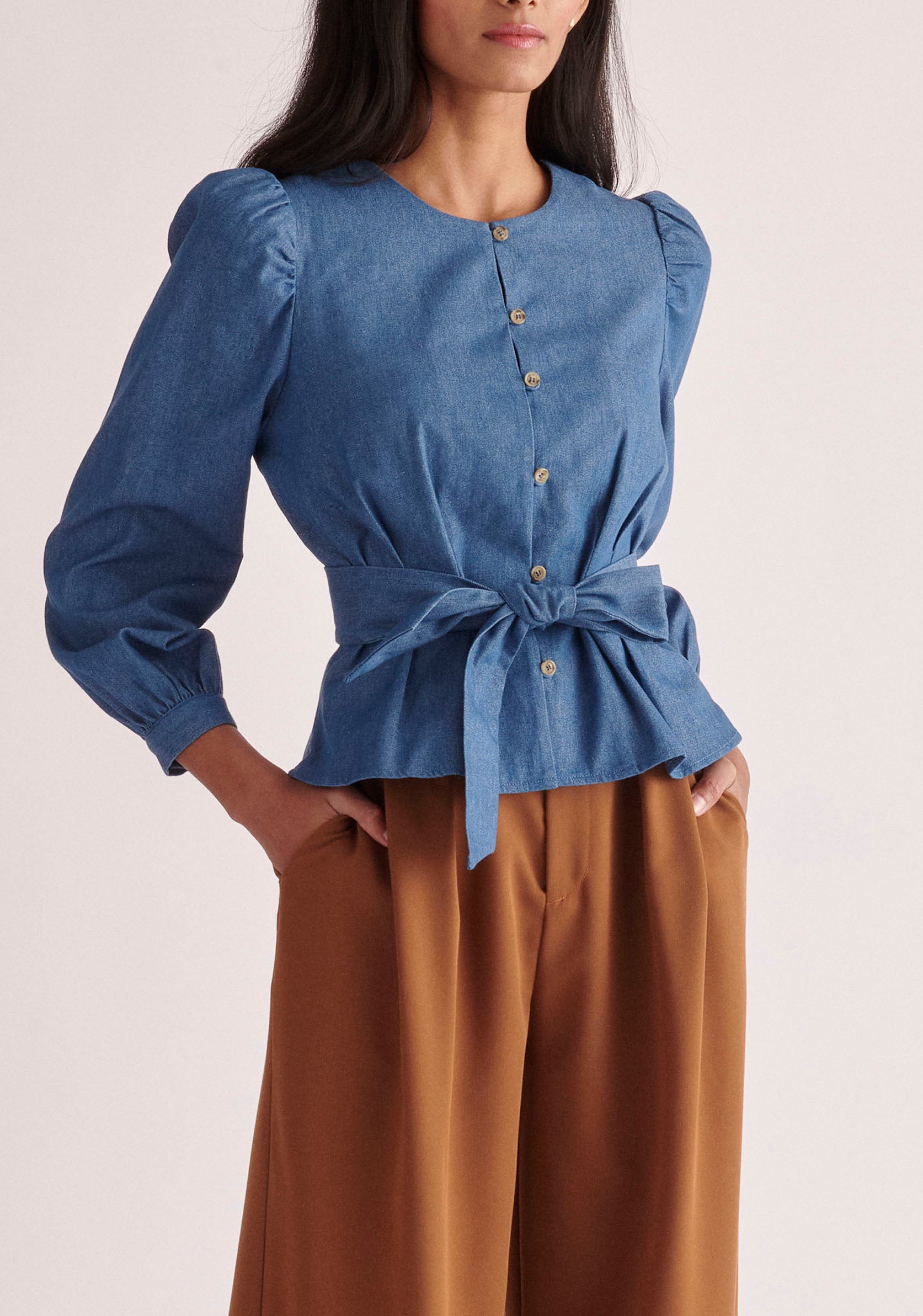 Paisie Long Sleeve Belted Denim Blouse in Light Blue 