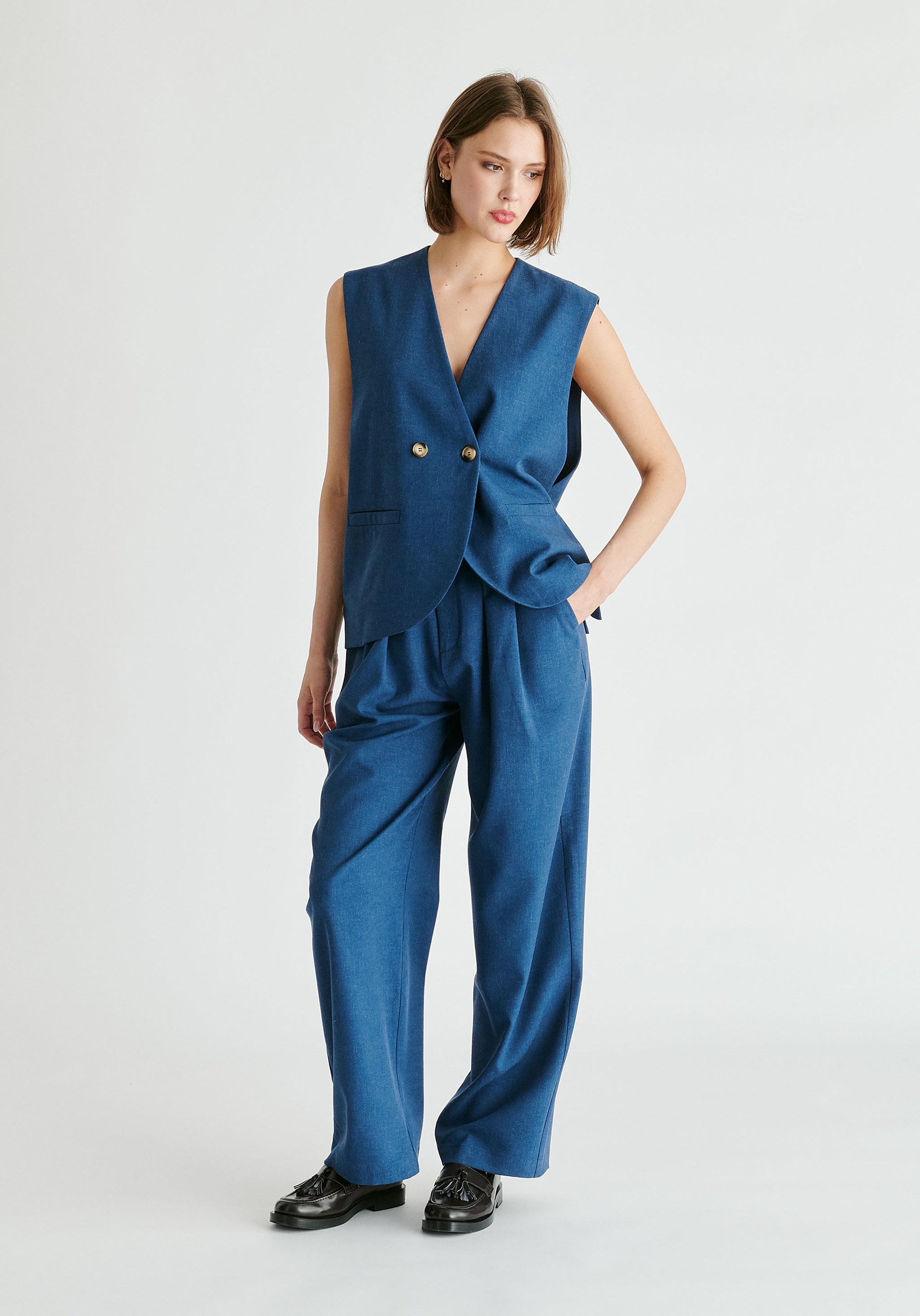 Side Buttoned Longline Waistcoat in Denim Blue