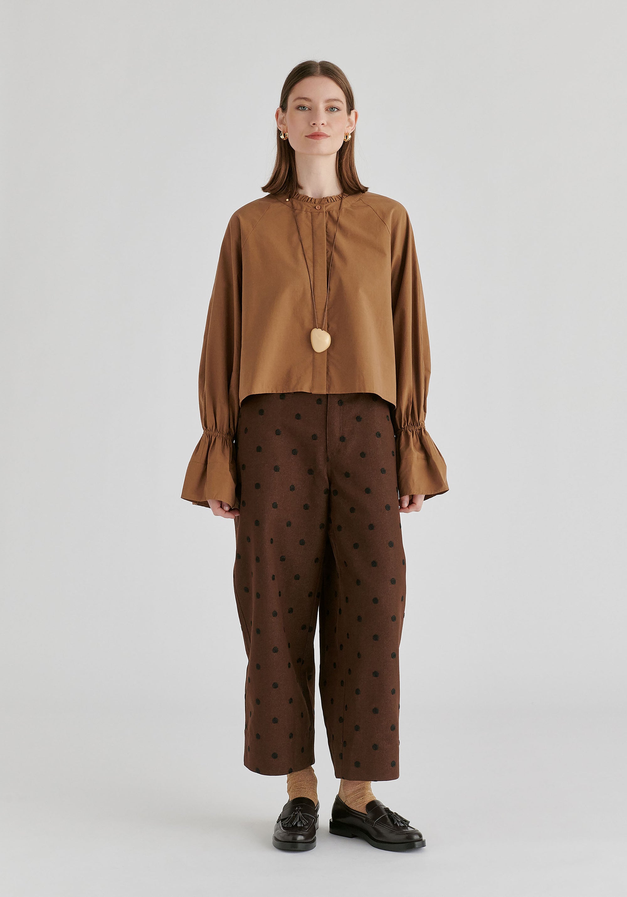 Ruffle Round Neck Blouse with Cinch Wrist Detail in Brown Front