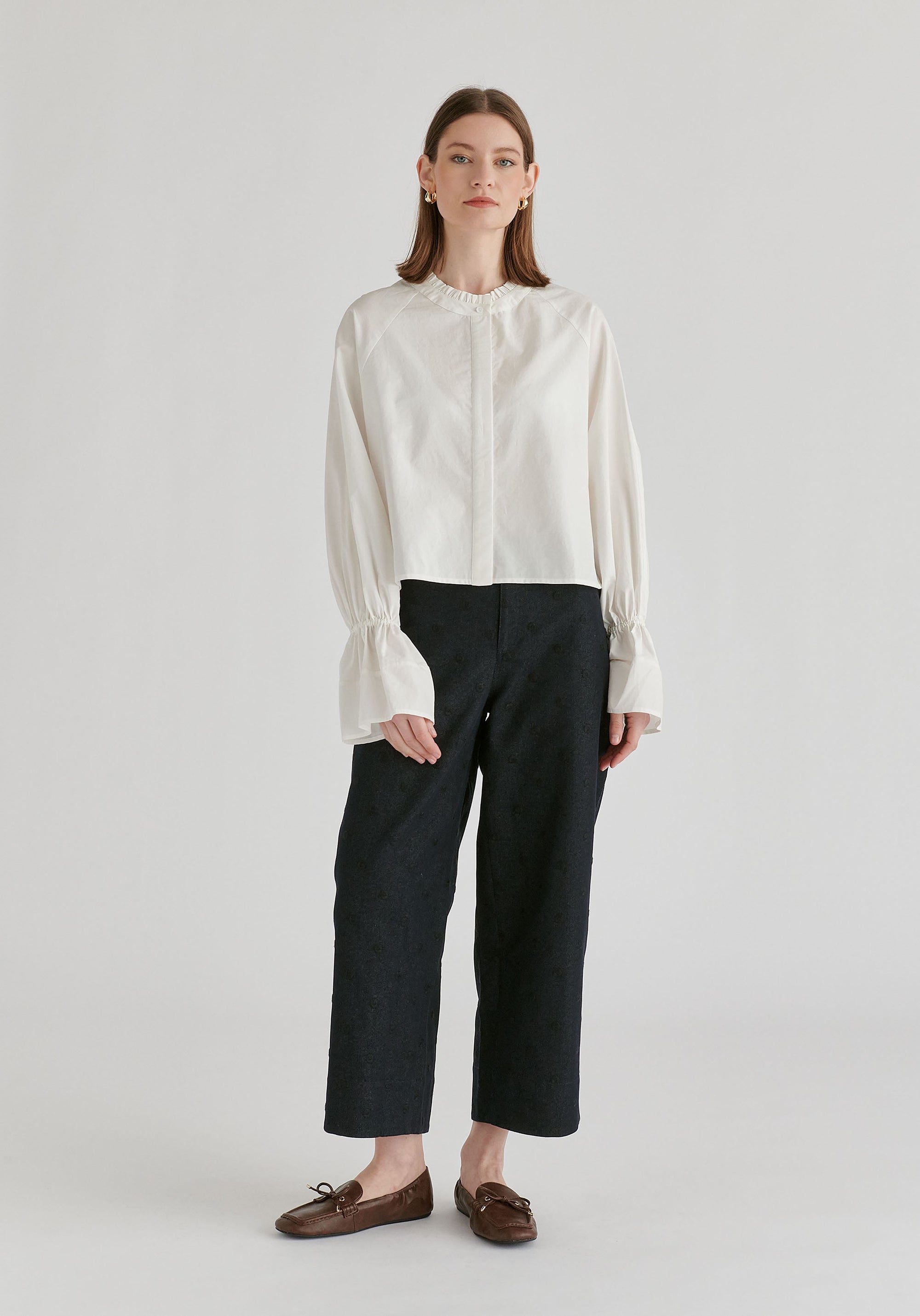 Ruffle Round Neck Blouse with Cinch Wrist Detail in White Front