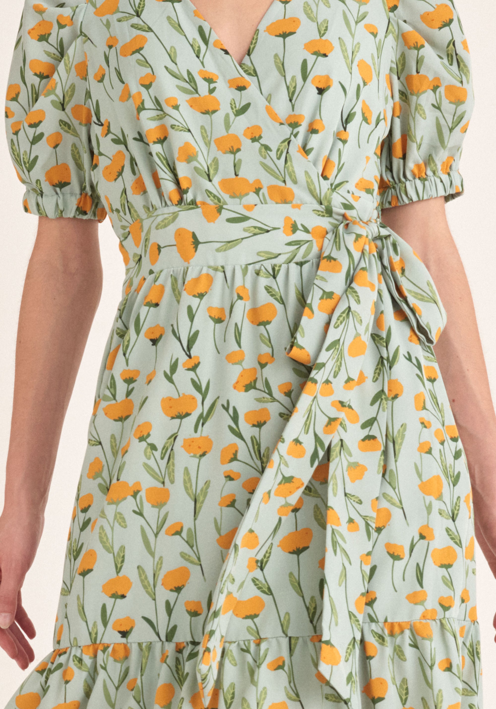 Paisie Floral Midi Wrap Dress with Peplum Hem in Green Close Up