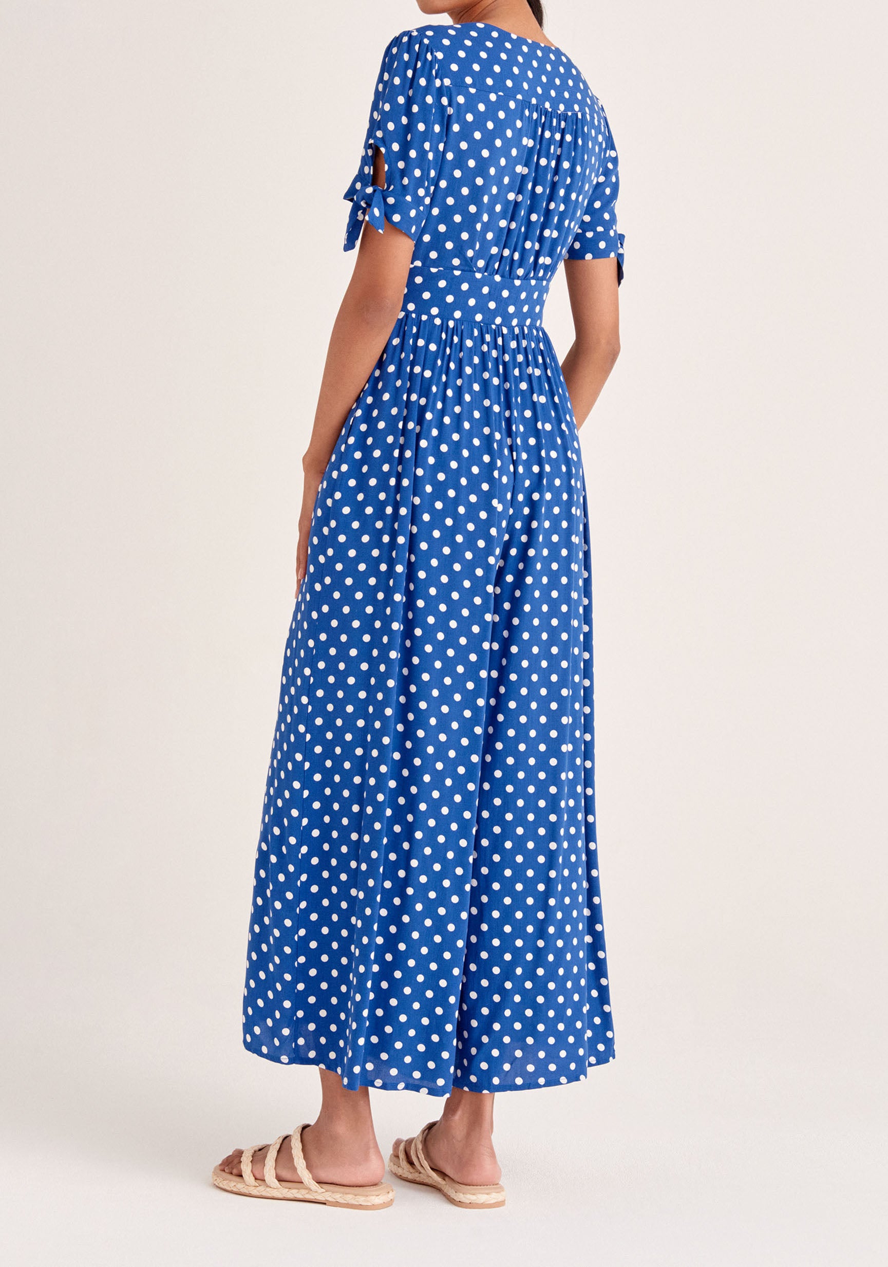 Paisie Sleeve Tie Polka Dot Jumpsuit in Dark Blue and White Back